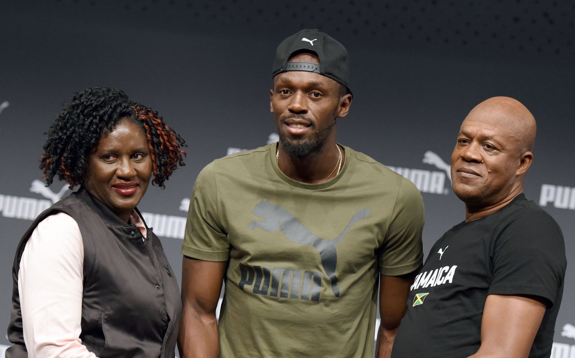 Usain Bolt and his parents at the Athletics World Championships press conference - (Source: Getty)